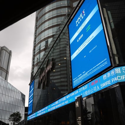 An electronic board showing the Hong Kong stock tickers near the Hong Kong Excanges and Clearing office in Central. Photo: AP