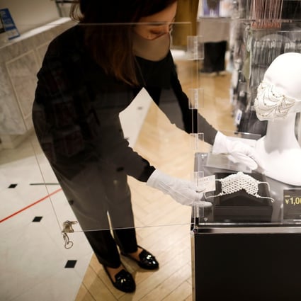 A million-yen handmade face mask decorated with a diamond and Swarovski crystals in Tokyo. Photo: Reuters/Issei Kato