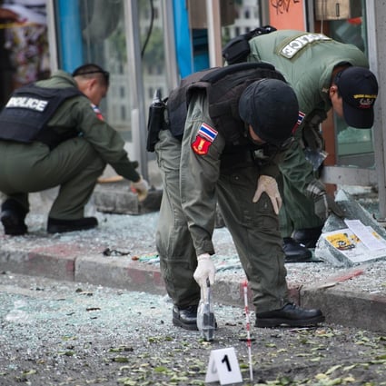 Thai bomb squad officials inspect the site of an explosion in Bangkok in February 2012. File photo: AFP