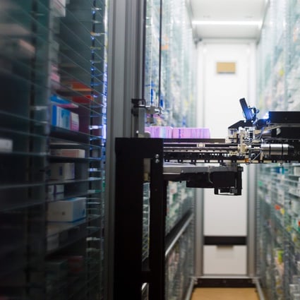 A robot retrieving medicines in the pharmacy of the Argenteuil hospital, in Argenteuil, a Paris suburb, as technology changes how business and services are delivered in pandemic. Photo: AFP