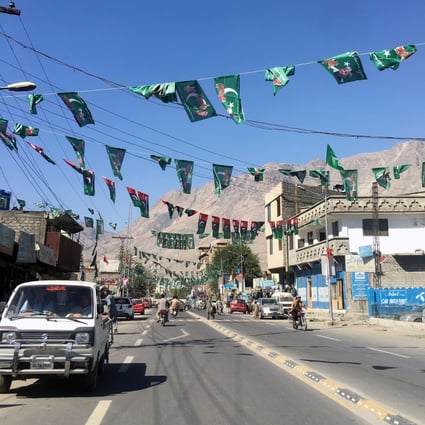 A vehicle drives past campaign flags of different political parties ahead of the legislative assembly elections in Gilgit Baltistan earlier this month. Photo: Reuters