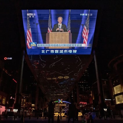 Footage of US president-elect Joe Biden is broadcast at a department store in Beijing. Photo: Reuters
