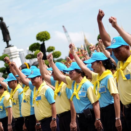 A group of Thailand’s ‘royal volunteers’ prepare to do painting and gardening work at the Temple of Dawn in Thonburi, Bangkok, last year. Photo: Reuters