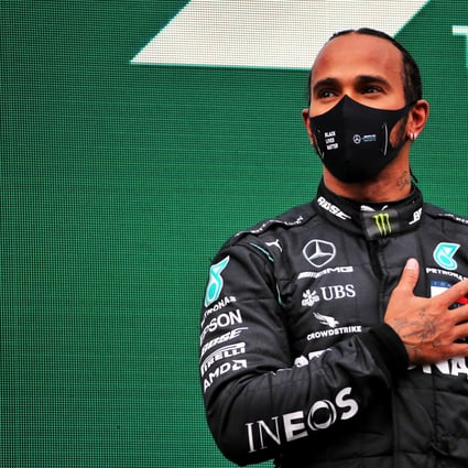 British Formula One driver of the Mercedes AMG Petronas team, Lewis Hamilton, celebrates on the podium after winning the Turkish Grand Prix and securing his seventh world championship. Photo: DPA