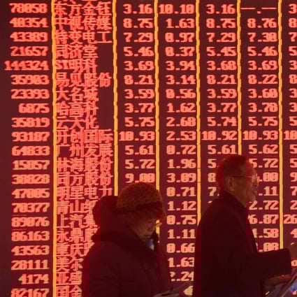 Investors at a stock exchange in the Zhejiang provincial capital of Hangzhou on February 11, 2019. Contrary to global conventions, China’s stock exchange denotes gains and advances in red, using the green colour to illustrate losses and declines. Photo: Xinhua