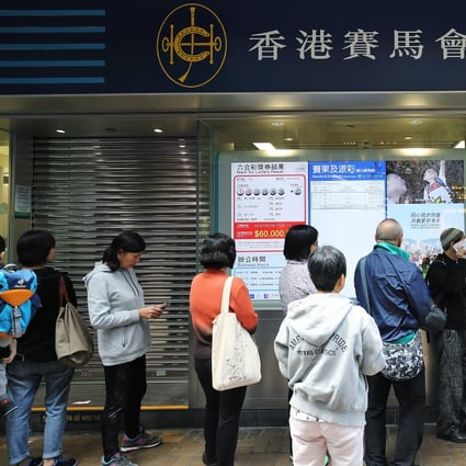 Punters line up to place bets at a Hong Kong Jockey Club betting branch in Tsim Sha Tsui on January 2, 2018. As a non-profit-making organisation, the Jockey Club does not need to strive to increase the betting amount and profit every year. Photo: Winson Wong