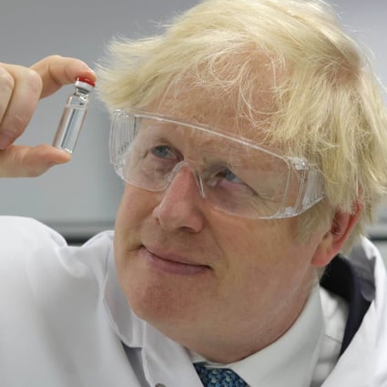 British Prime Minister Boris Johnson holds up the AstraZeneca-Oxford coronavirus vaccine on a visit to pharmaceutical and biotech company Wockhardt in Wales. Photo: No 10 Downing Street handout via dpa