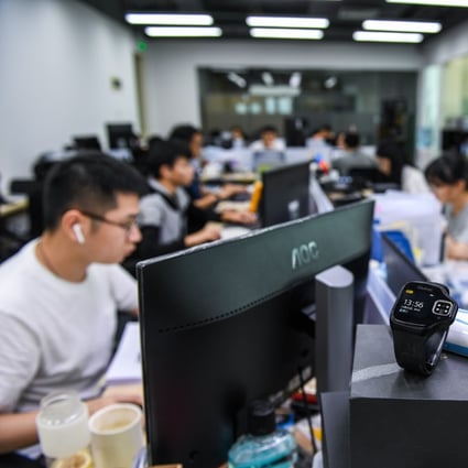 Employees work at a start-up company at the Guangdong, Hong Kong and Macau youth innovation and entrepreneurial base in Shenzhen on August 12. A new scheme announced by the Hong Kong government could draw more local youth to cities in the Greater Bay Area. Photo: Xinhua