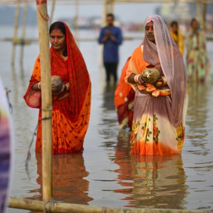 Indian Hindu devotees perform rituals at the bank of the Brahmaputra River in Guwahati, Assam India. Photo: EPA-EFE