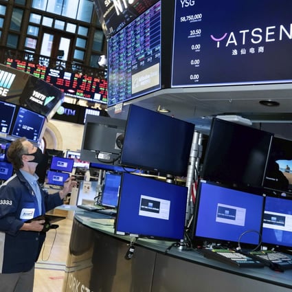 Traders work the floor of the New York Stock Exchange during the IPO of Chinese cosmetics company Yatsen Holding Ltd on November 19. Photo: NYSE via AP