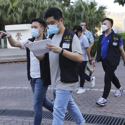 Officers from the police national security department carry out an investigation after the rally at Chinese University last month. Photo: Dickson Lee