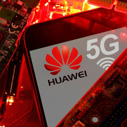 A smartphone with the Huawei and 5G network logo is seen on a PC motherboard in this illustration picture taken January 29, 2020. Photo: Reuters