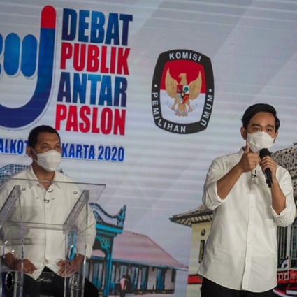 Mayoral candidate Gibran Rakabuming, the eldest son of President Joko Widodo, speaks alongside his running mate Teguh Prakosa during an election debate for mayor and deputy mayor in Solo on November 6. Photo: Reuters