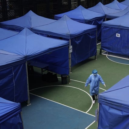A medical worker in a protective suit at a coronavirus testing centre in Hong Kong on December 8, as the city confronts an alarmingly worsening fourth wave of the Covid-19 pandemic. Photo: AP