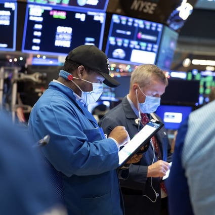 Traders work on the floor of the New York Stock Exchange. Photo: New York Stock Exchange/ AP