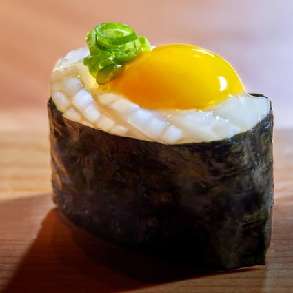 Sushi Hakucho’s ika and quail egg yolk sushi. Photo: handout