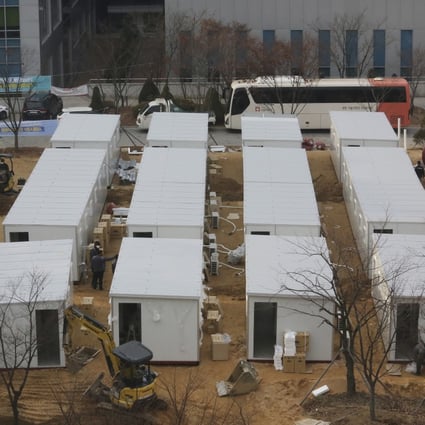 Workers put in place a temporary hospital ward made of shipping containers outside the Seoul Medical Centre on Thursday. Photo: AP