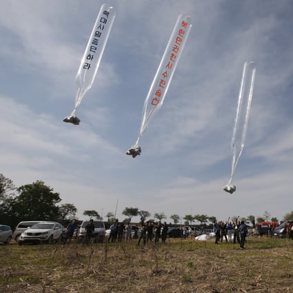 Members of Fighters for Free North Korea, an organisation of defectors from North Korea, send balloons carrying anti-Pyongyang leaflets across the border from the South Korean border city of Paju. Photo: EPA