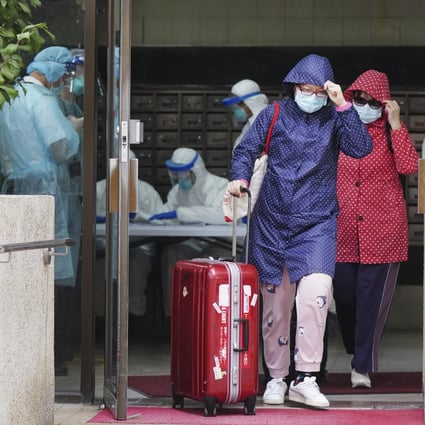 Residents leave Block 6 of Richland Gardens in Kowloon Bay. Photo: Sam Tsang