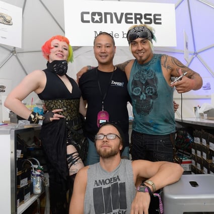 Tony Hsieh (back, centre) with artists Heather Hermann (left), Gear Duran (right) and Brett Bandriwski at the 2015 Life is Beautiful festival in Las Vegas, Nevada. Photo: WireImage/Getty Images