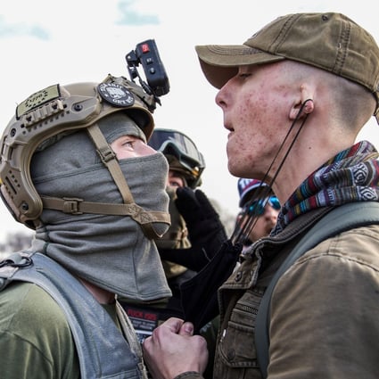 A member of the Proud Boys clashes with a member of Antifa during a protest in support of President Donald Trump in Washington on Saturday. Photo: dpa