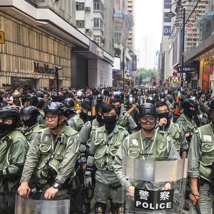 Riot police on standby in Causeway Bay as protesters gathered for a march last year. Photo: Sam Tsang
