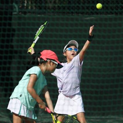 Children play tennis in Quarry Bay Park on September 12, after social-distancing rules were relaxed. The fourth wave of Covid-19 cases in Hong Kong has again led to the closure of outdoor sports venues from December 10 until further notice. Photo: Xiaomei Chen
