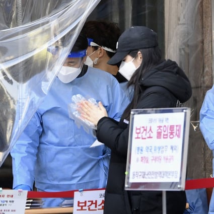 A woman attends a coronavirus test centre in Seoul. Photo: Kyodo