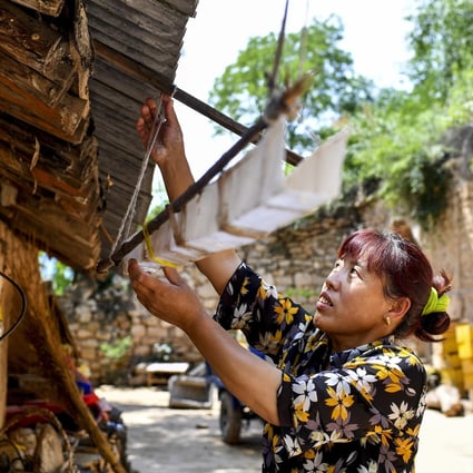 At least a dozen provinces in China are suffering from water scarcity. A villager in Yicheng county, Shanxi province, is seen here collecting rainwater. Photo: Xinhua