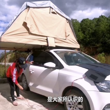 To save money, Su Min sleeps in a tent on top of her car at night. Photo: Weibo/Su Min