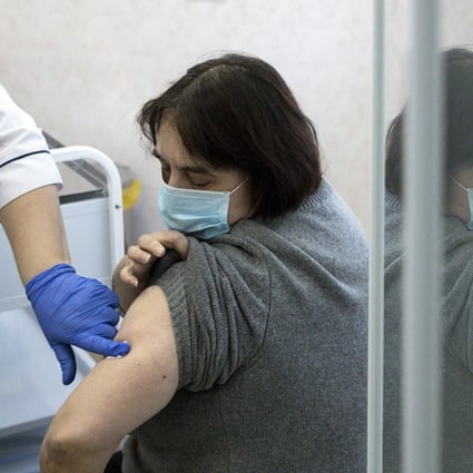 A medical worker finishes the procedure after administering a shot of Russia’s Sputnik V coronavirus vaccine in Moscow. Photo: AP