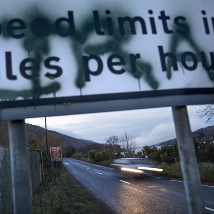 A sign in Newry, Northern Ireland, on the border between Northern Ireland and the Republic of Ireland, spray-painted with the initials of the Irish Republican Army on December 17, 2019. Photo: AP