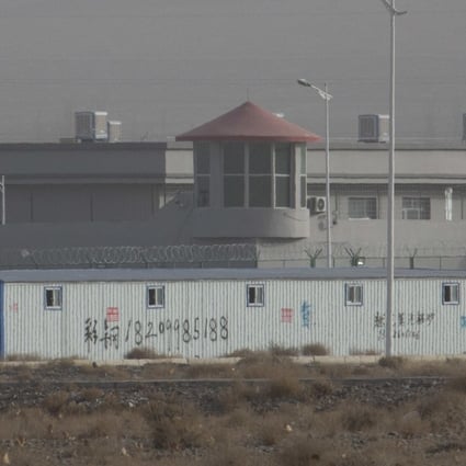 A guard tower and barbed wire fences are seen around a facility in the Kunshan Industrial Park in Artux, Xinjiang. China has denied allegations of human rights abuses. Photo: AP