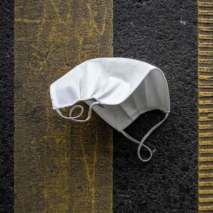 A discarded protective face mask lies on a parking place in November in Lausannem France. Photo: AFP