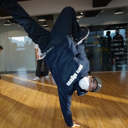 Leon, Fusion MC's top-ranked B-boy, does a Nike freeze. Photo: David D. Lee