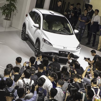 He Xiaopeng, chairman and co-founder of Xpeng Motors, speaks as he stands next to the company’s G3 electric SUV, at the Guangzhou International Automobile Exhibition, in Guangzhou, China, on November 16, 2018. Photo: Bloomberg