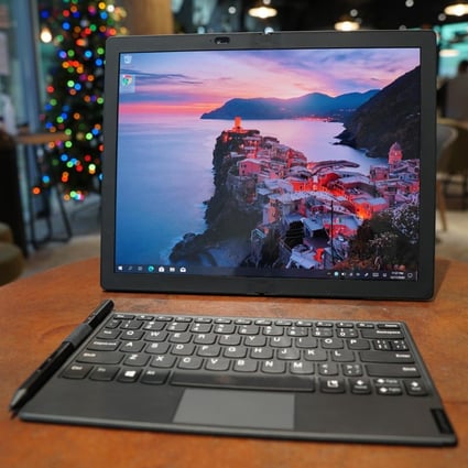 The Lenovo ThinkPad X1 Fold, a 13.3-inch tablet with a foldable screen, keyboard and stylus, in unfolded large-screen mode. Photo: Ben Sin