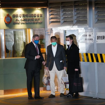 Jimmy Lai leaves the High Court on Wednesday night with his lawyers. Photo: Sam Tsang