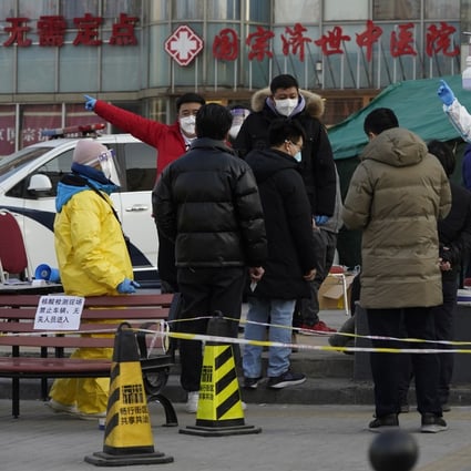Residents line up for coronavirus tests at tents set up on the streets of Beijing on Sunday. Photo: AP