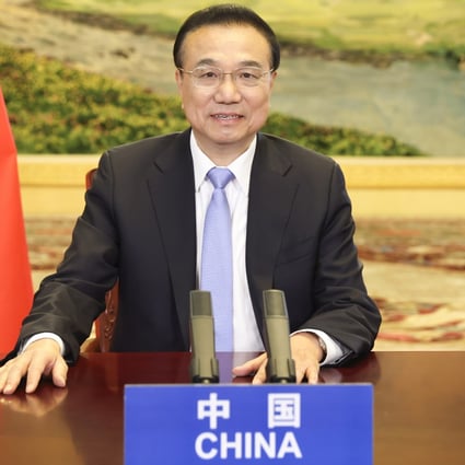 Chinese Premier Li Keqiang, shown via video link at an Organisation for Economic Cooperation and Development event last week, has called the Dutch and Spanish prime ministers in a bid to shore up support for the proposed EU-China trade deal. Photo: Xinhua
