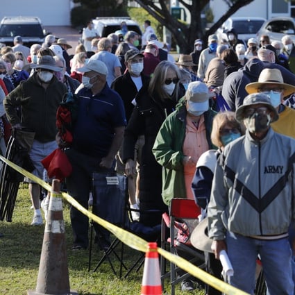 Cape Coral, Florida residents wait in line to receive a Covid-19 vaccine. Photo: AP