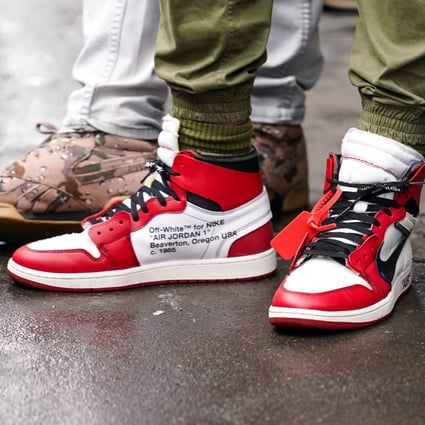 A guest at Paris Fashion Week wears “Off-White for Nike” Air Jordan 1 sneakers. 2020 was a banner year for streetwear and sneaker aficionados. Photo: Getty Images