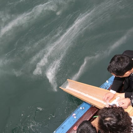 Family members scatter a loved one’s ashes at sea near Tung Lung Chau. Photo: Edward Wong