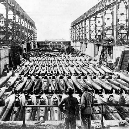 Members of a US military inspection team visit a dry dock at the Kure Naval Arsenal in Hiroshima. Photo: US Navy