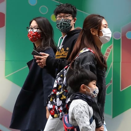 People wearing face masks are seen on a street in Hong Kong on December 25. Hongkongers who share the common goal of achieving democracy should live up to its principles and respect diverse opinions. Photo: Xinhua
