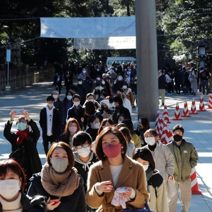 Japanese in protective masks walk to pray on the first day of the new year at the Meiji Shrine in Tokyo, Japan, on Friday. Photo: Reuters