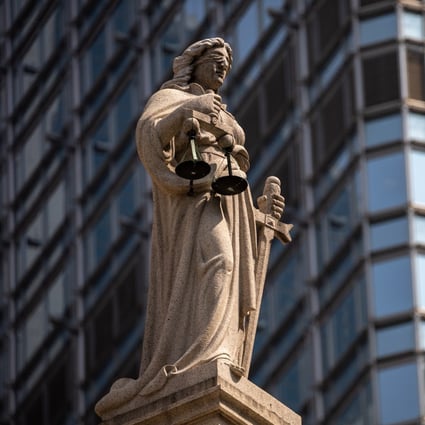 A statue of Lady Justice sits on top of the Court of Final Appeal in Hong Kong. Photo: EPA-EFE