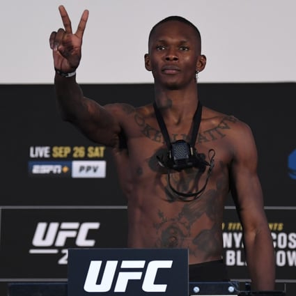 Israel Adesanya poses on the scale during the UFC 253 weigh-in on September 25, 2020 at Flash Forum on UFC Fight Island, Abu Dhabi, United Arab Emirates. Photo: Josh Hedges/Zuffa LLC via Getty Images