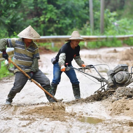 Villagers renovate a rural road in south China’s Guangxi Zhuang Autonomous Region, a mountainous region plagued by poverty. Photo: Xinhua