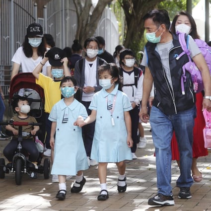 Children leave after class from a primary school in Tsz Wan Shan on November 20. Kindergartens and primary schools in Hong Kong had only a fraction of their usual number of class days in 2020, after a series of closures that are now set to last until after the 2021 Lunar New Year holiday. Photo: Edmond So